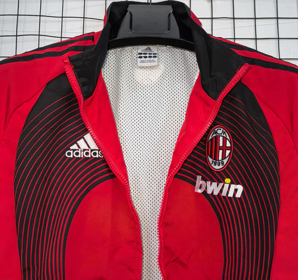 AC Milan windbreaker 2025 featuring Adidas logo and stylish design for football fans