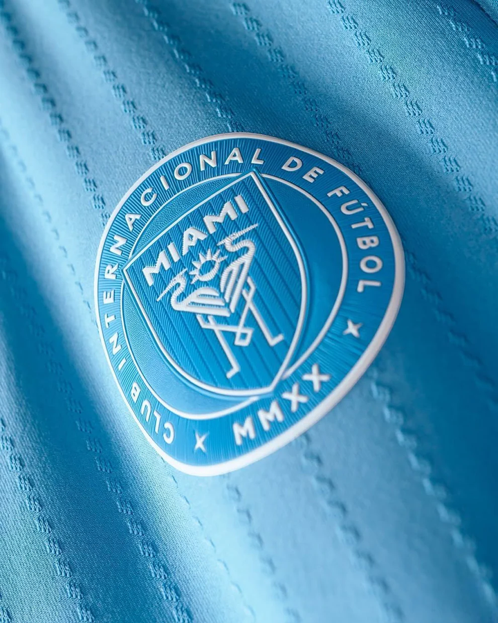 Inter Miami 2025-26 Third Jersey close up of light blue fabric with raised club crest and textured stitch lines