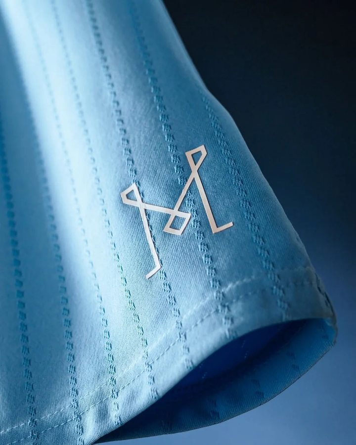 Close up light blue fabric sleeve with stitched texture and club emblem on Inter Miami 2025-26 Third Jersey from Striker Store