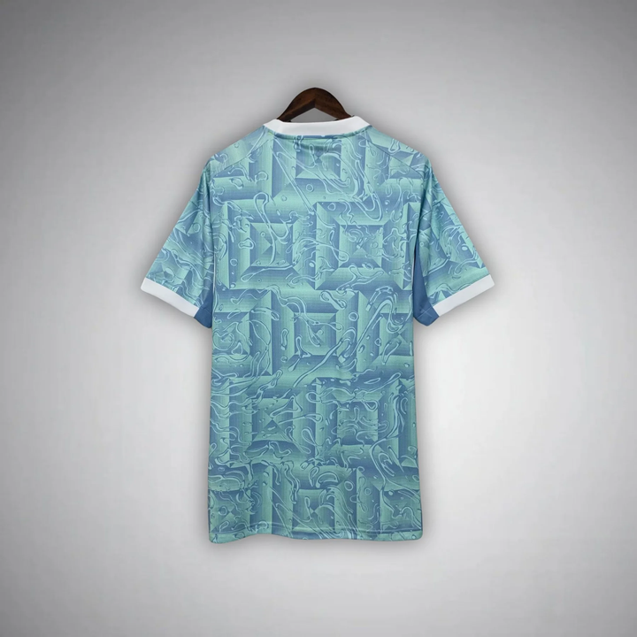 Back view of Juventus away jersey 25-26 with light blue geometric pattern and white collar