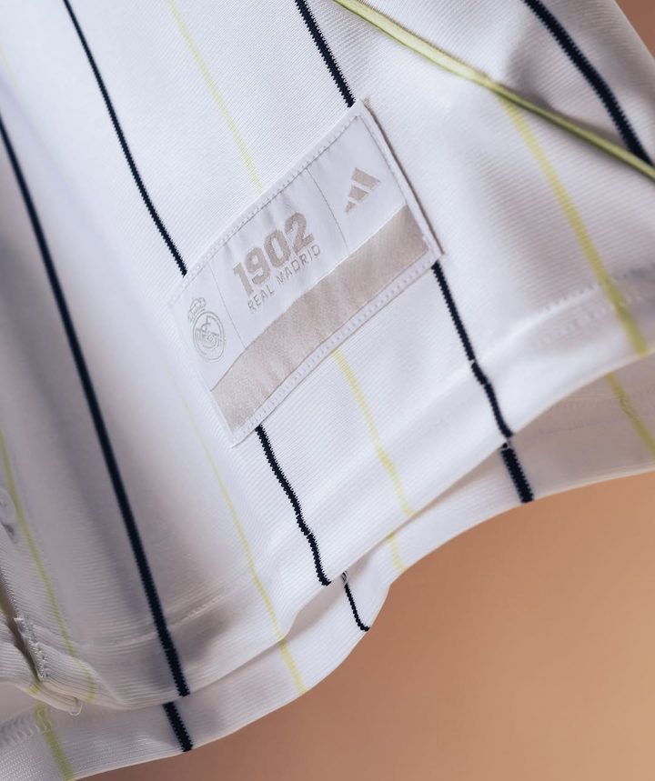 Striker Store Real Madrid special edition jersey 2025-26 white pinstripe close up with Adidas tag