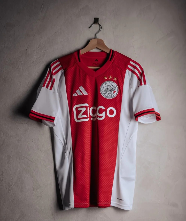 Ajax home jersey 2025-26 player version featuring red and white colors with Adidas logo