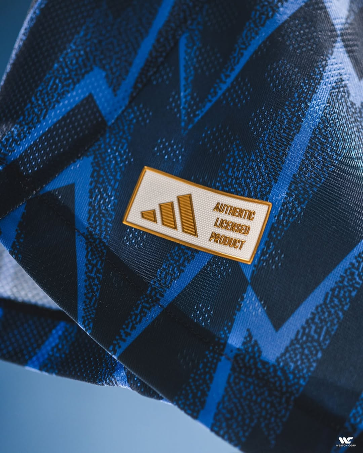 Close-up of the authentic label on the Arsenal away jersey 2025-26 featuring a unique design