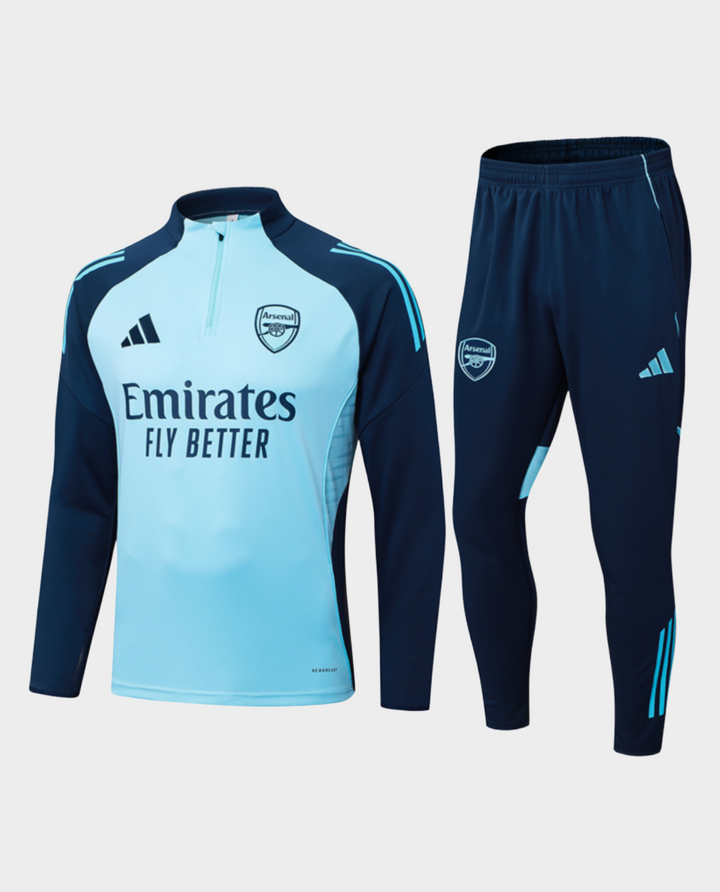 Striker Store Arsenal blue training suit 2025-26 featuring a zip-up top and fitted pants