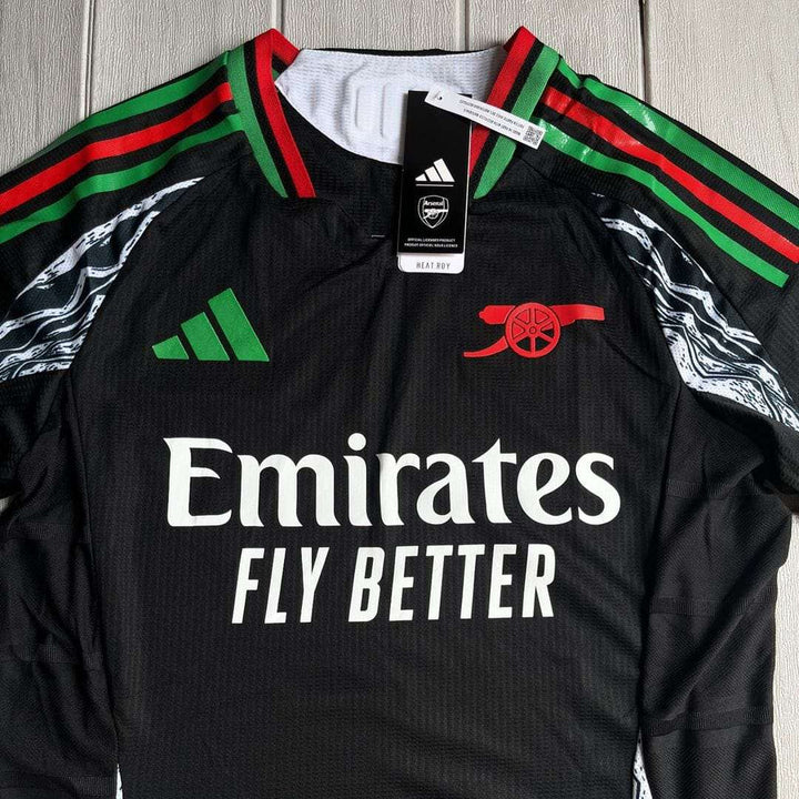 Striker Store Fan version Arsenal jersey in black with Emirates branding and Adidas stripes