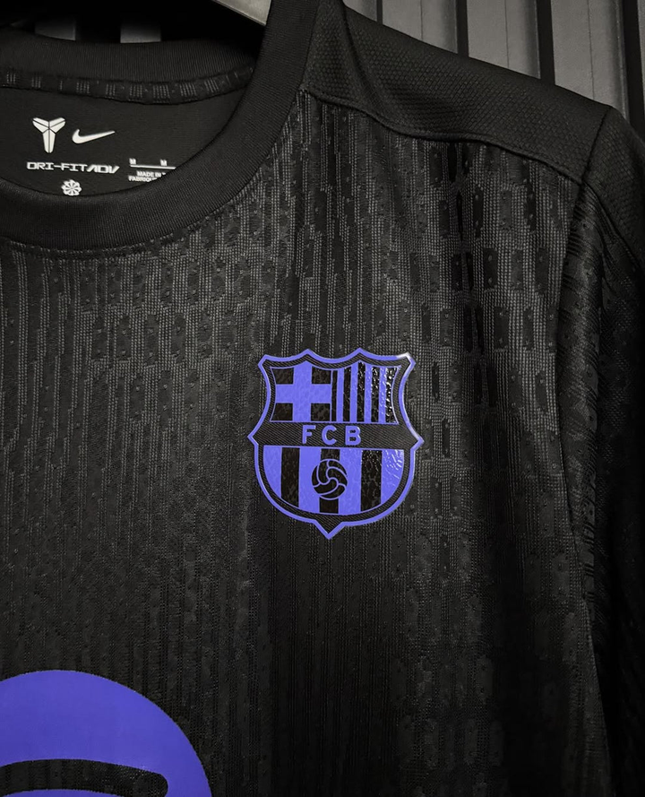 Close-up of FC Barcelona Kobe Bryant pre match jersey showcasing the team logo and details