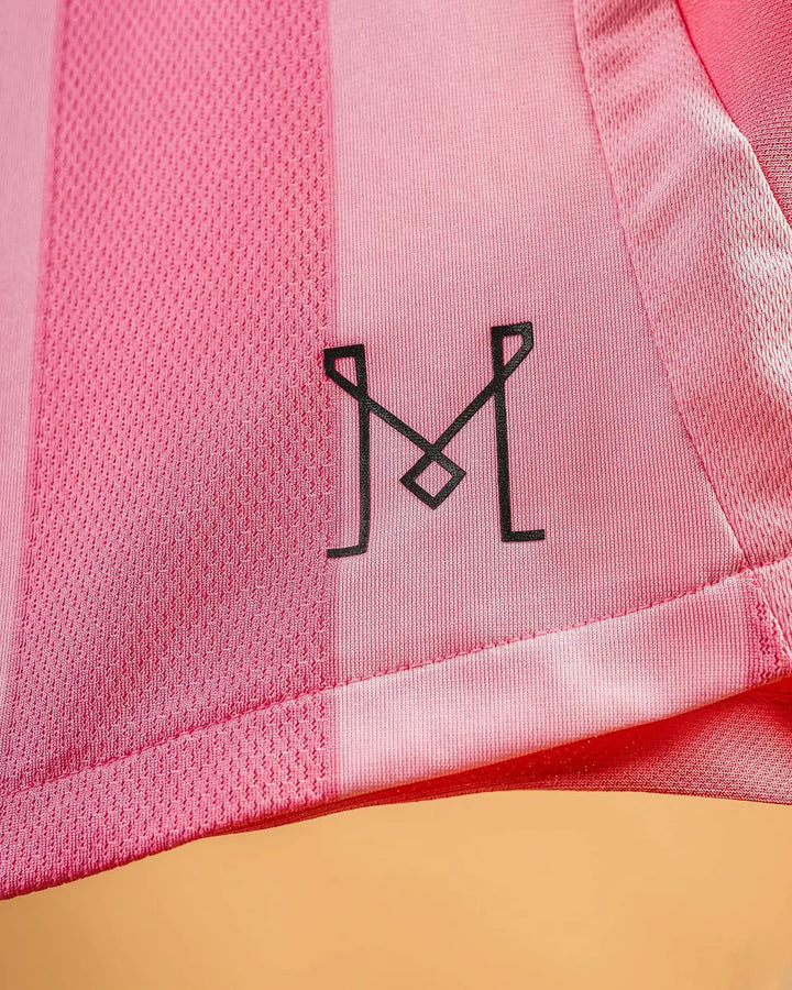 Close-up of the Inter Miami home jersey 2024 featuring the stylish logo detail on soft pink fabric