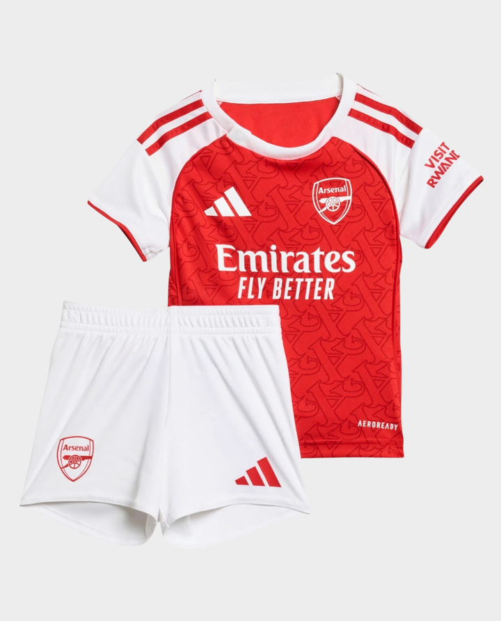 Kids Arsenal home kit 2025-26 featuring red jersey and white shorts with Emirates branding
