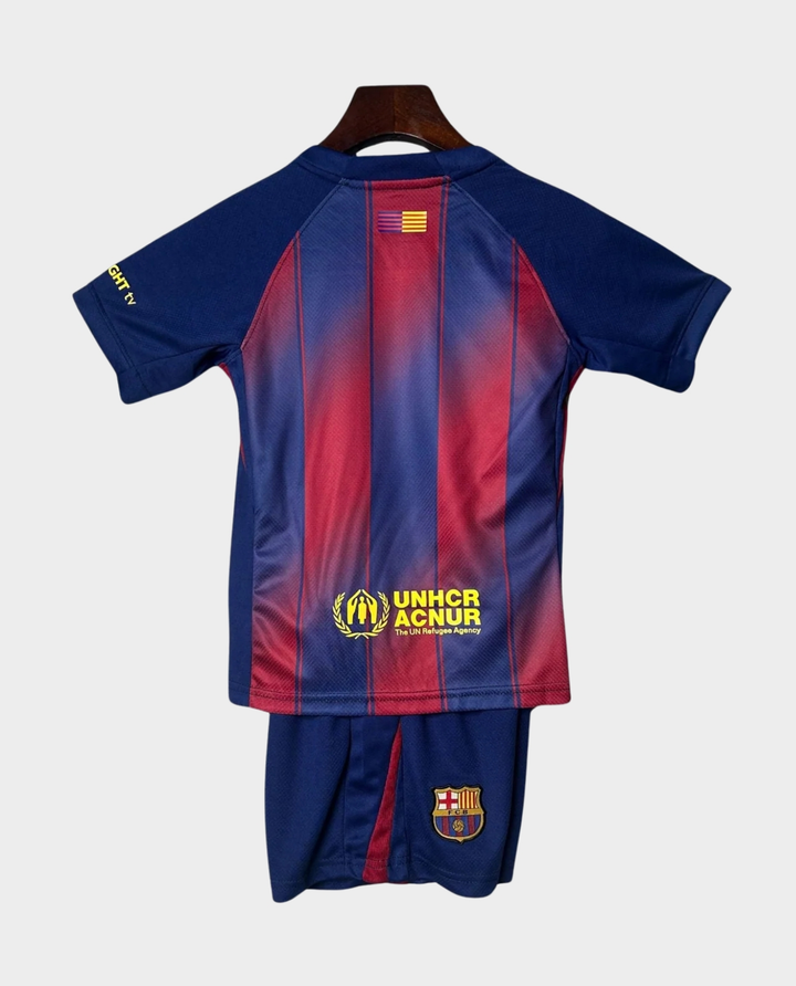 Kids Barcelona Home Kit 2025-26 featuring team colors and logo, ideal for young fans