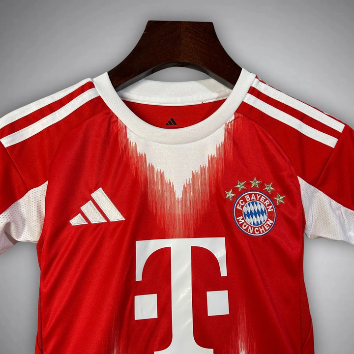 Kids Bayern Munich 2025-26 home kit featuring classic red design and iconic club logo