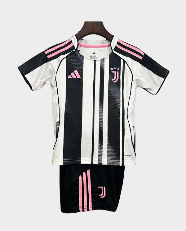 Kids Juventus home kit 2025 featuring black and white stripes with pink accents for young fans