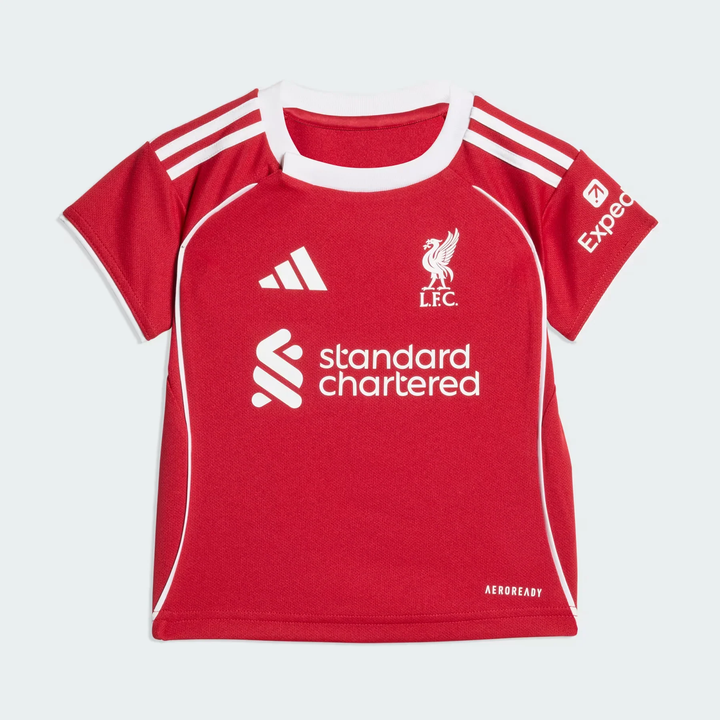 Kids Liverpool home kit 2025-26 featuring red jersey with Adidas logo and Standard Chartered print