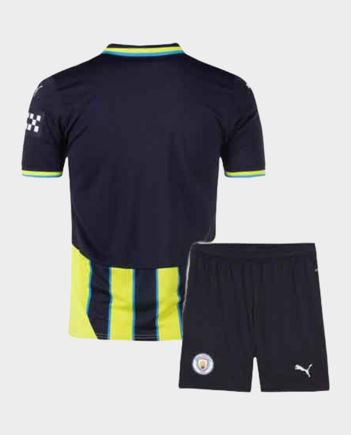 Kids Manchester City away jersey set in navy with bright accents and matching shorts
