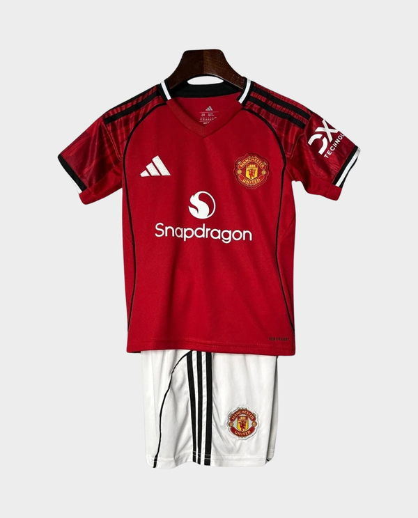 Kids Manchester United 2025-26 home kit featuring a red jersey with shorts for young fans