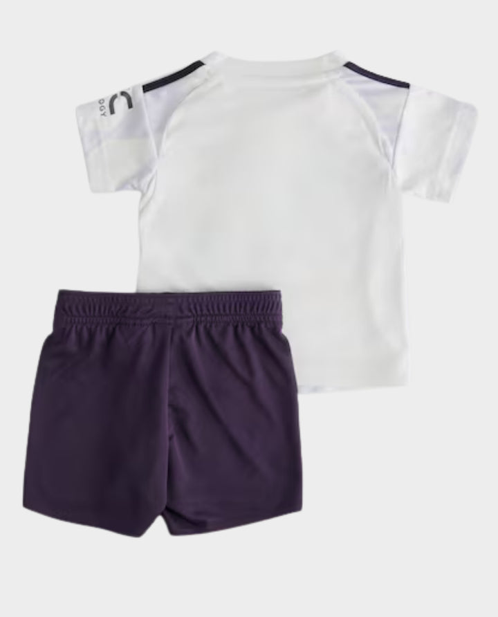 Kids Manchester United Away Kit 2025-26 featuring a white shirt and purple shorts for young fans