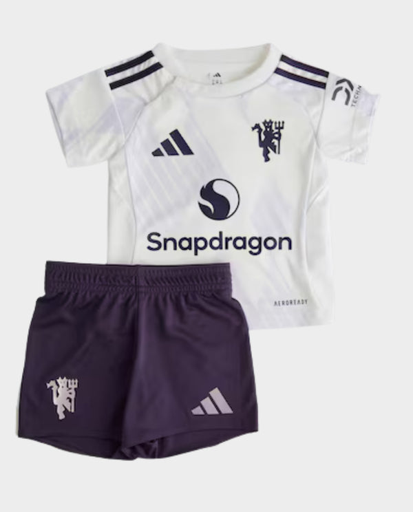 Kids Manchester United Away Kit 2025-26 featuring a white jersey and purple shorts for young fans