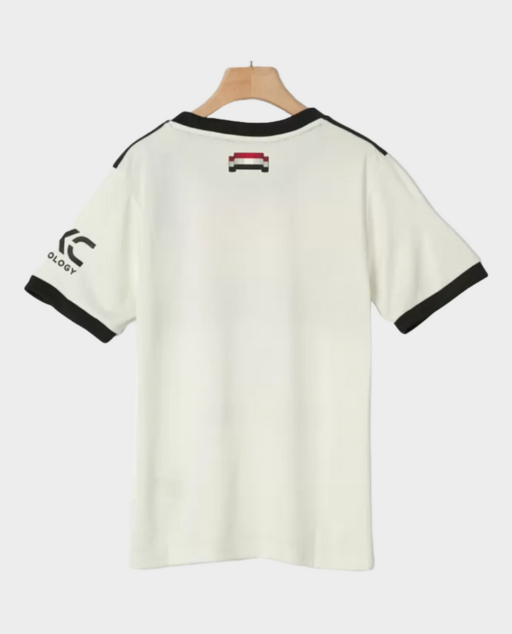 Kids Manchester United jersey 2024 in white with stylish black accents and comfortable fit