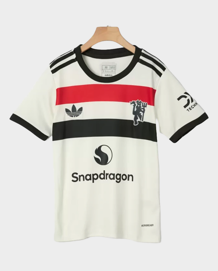 Kids Manchester United jersey 2024 featuring a stylish design with bold colors and brand logos