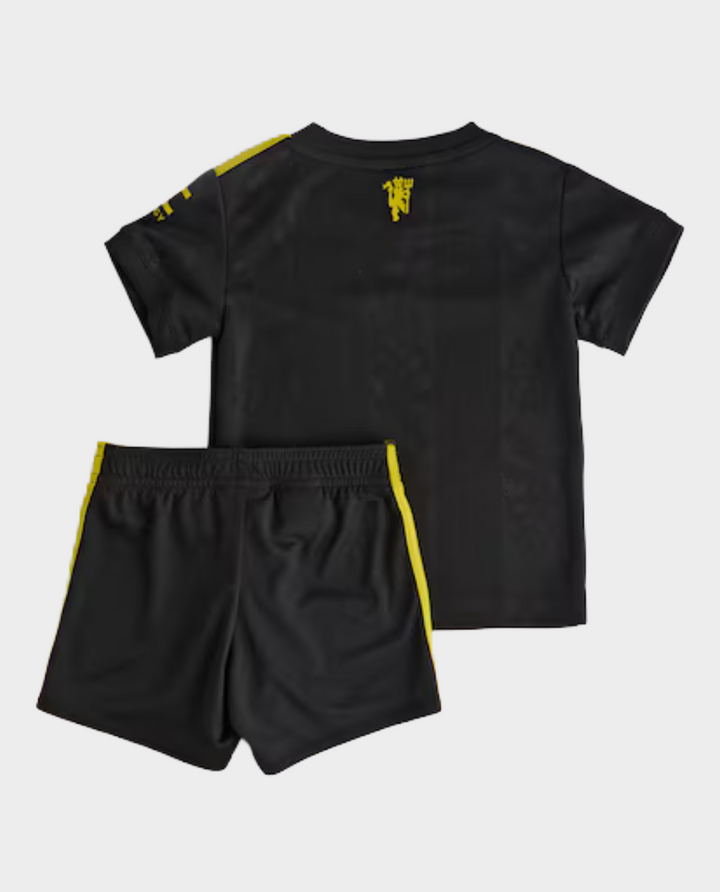 Kids Manchester United third kit 2025-26 featuring a black jersey and shorts with yellow accents