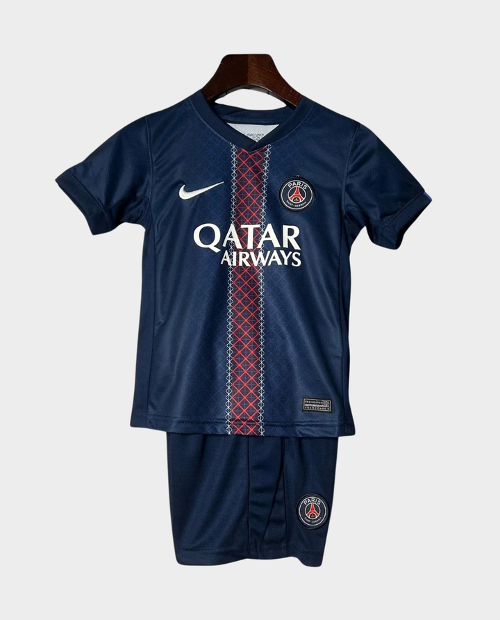 Kids PSG home kit 2025-26 jersey set in navy blue with Qatar Airways logo and authentic design