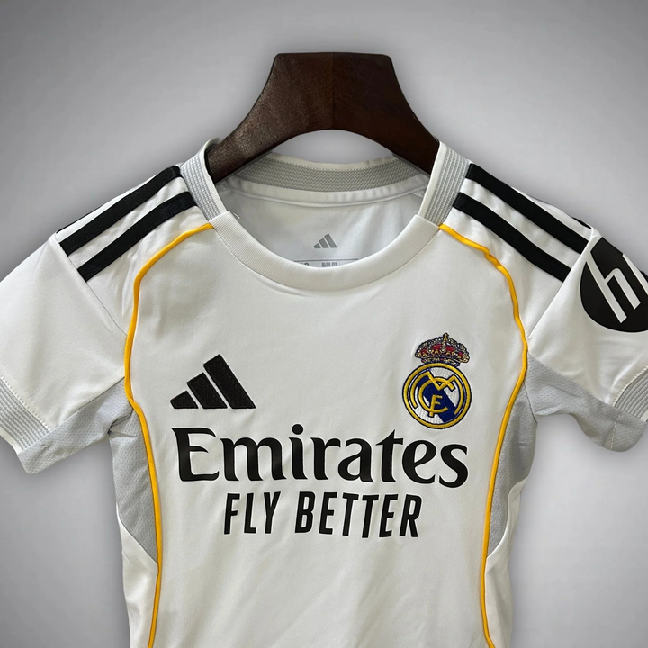Kids Real Madrid home kit 2025-26 featuring the iconic club logo and Emirates branding
