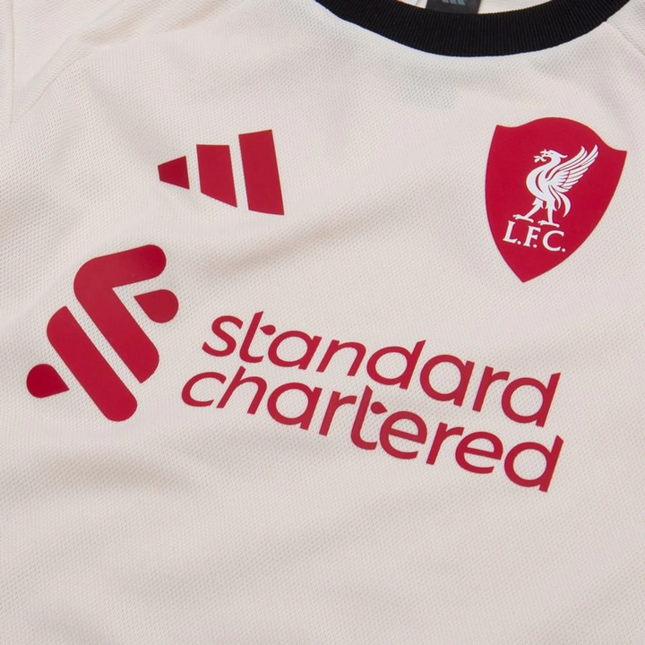 Liverpool away kit 2025-26 for kids featuring white design with club logo and sponsor branding