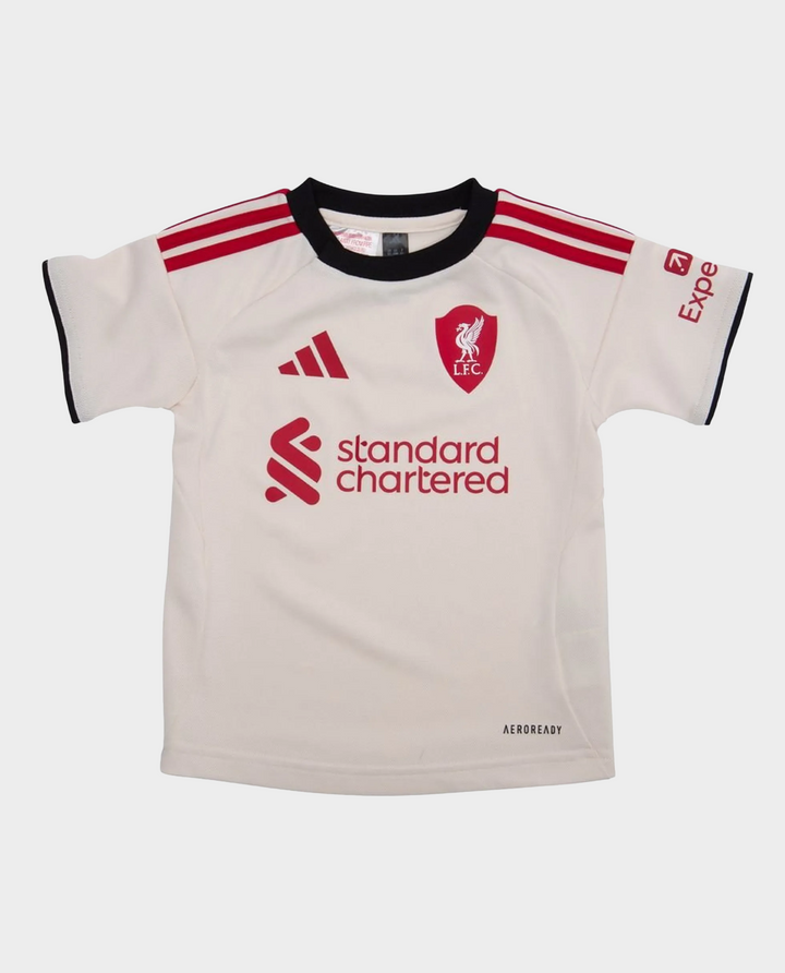 Liverpool away kit 2025-26 for kids featuring a light jersey with red accents and logo