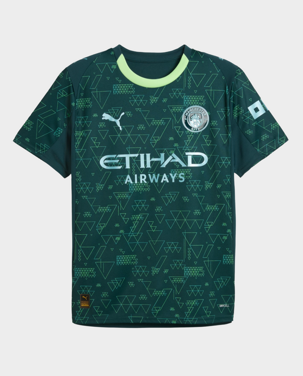 Manchester City Fourth Jersey 2025-26 in green featuring geometric patterns and club logo