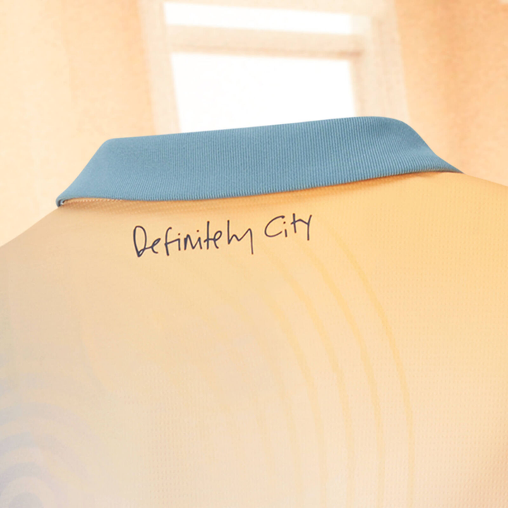 Manchester City jersey 2024 featuring a stylish collar and unique graphic on the back