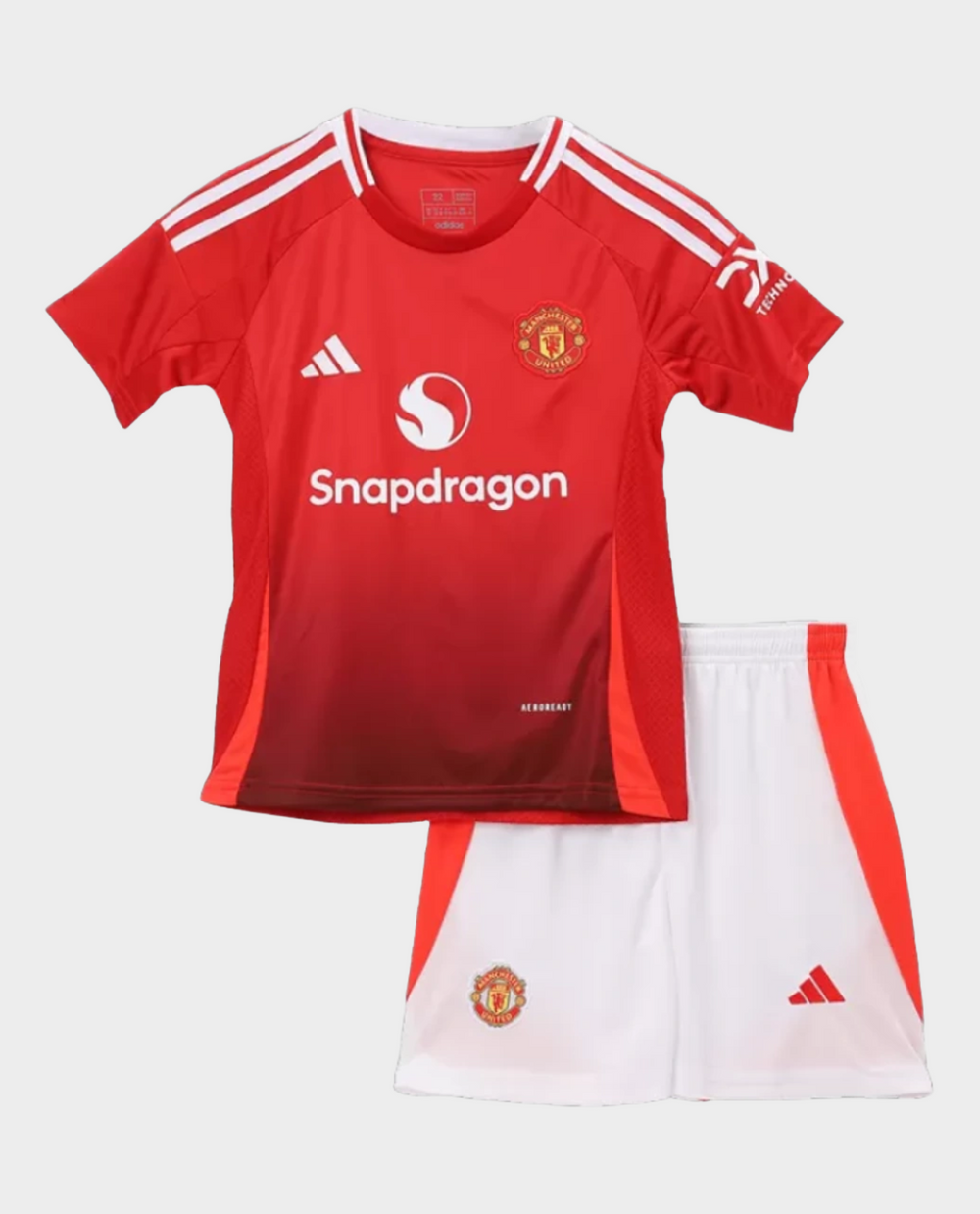 Kids Manchester United jersey 2024 Set with Red Shirt and White Shorts from Striker Store